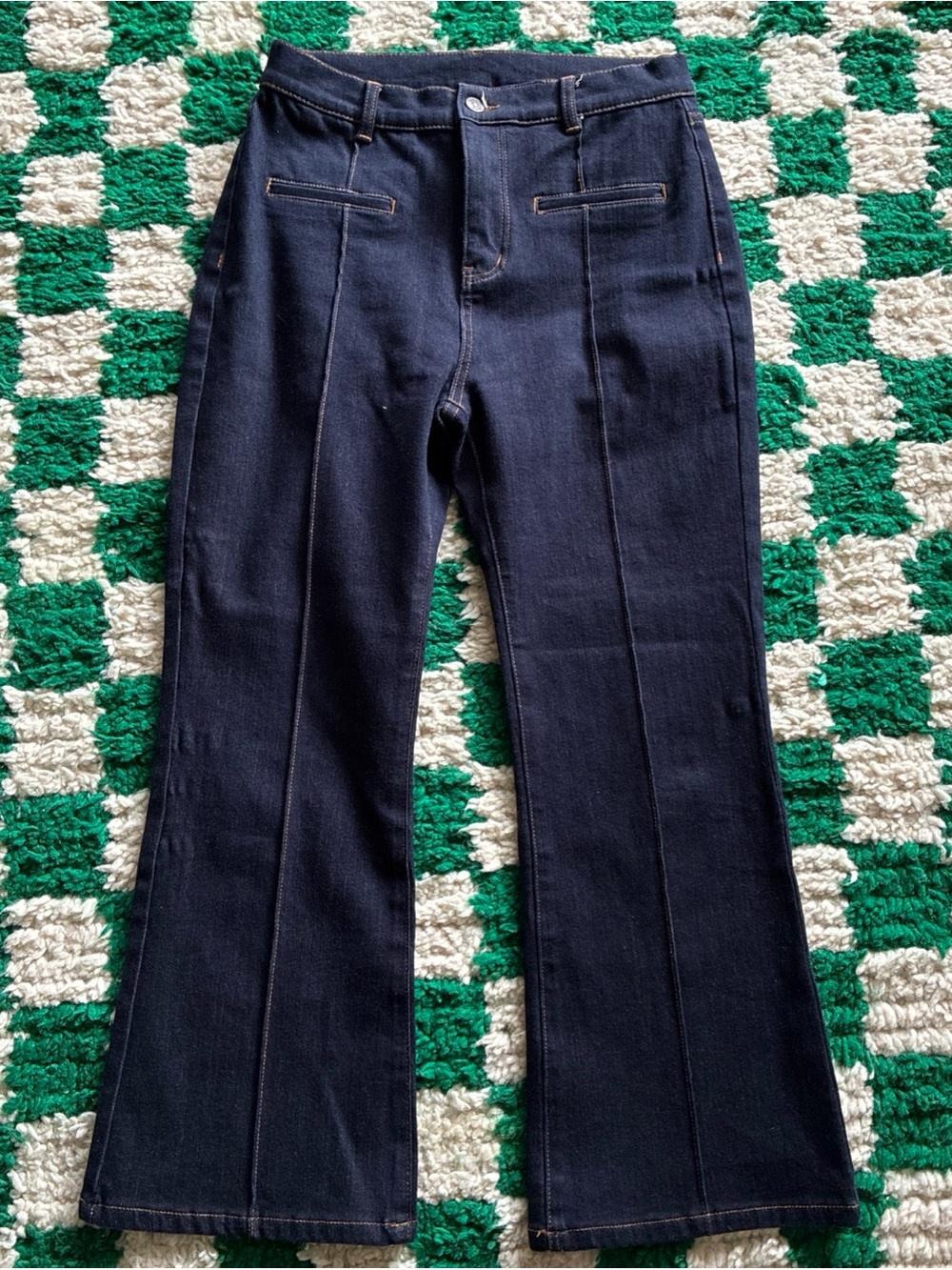 The Row dark wash indigo high-rise denim trousers front pocket pintuck seam